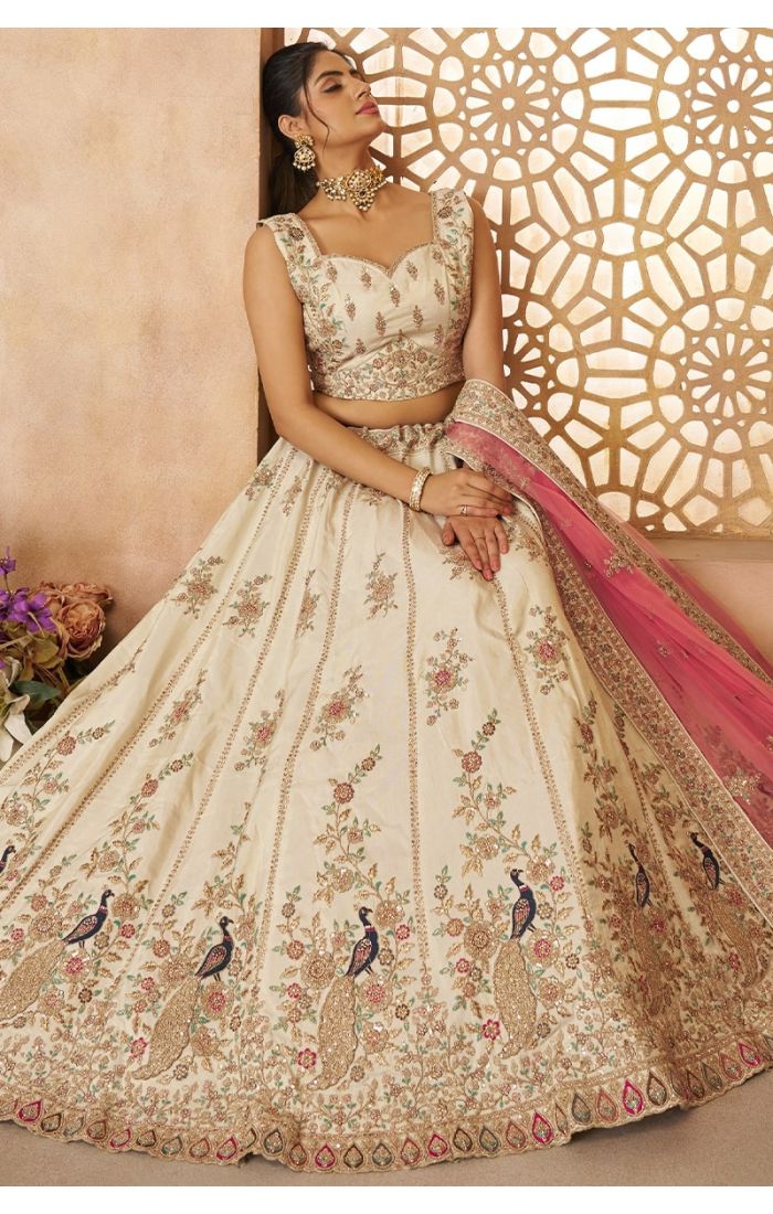  “Full View of Flowy Beige Bridal Lehenga with Peacock Motifs – Appelle Fashion”