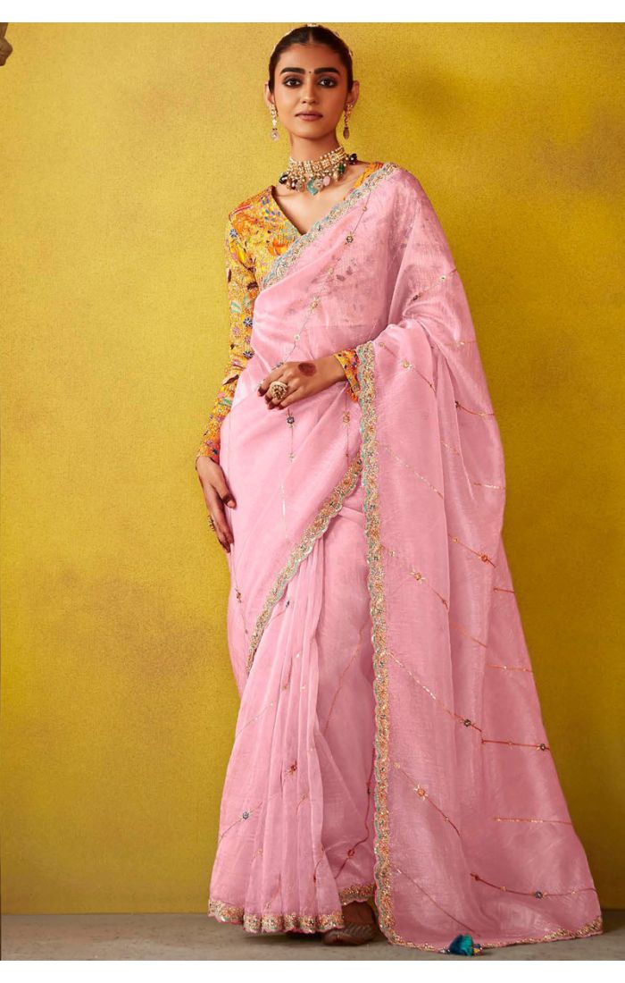 Blush pink silk saree with hand-embroidered floral blouse for EID and weddings.