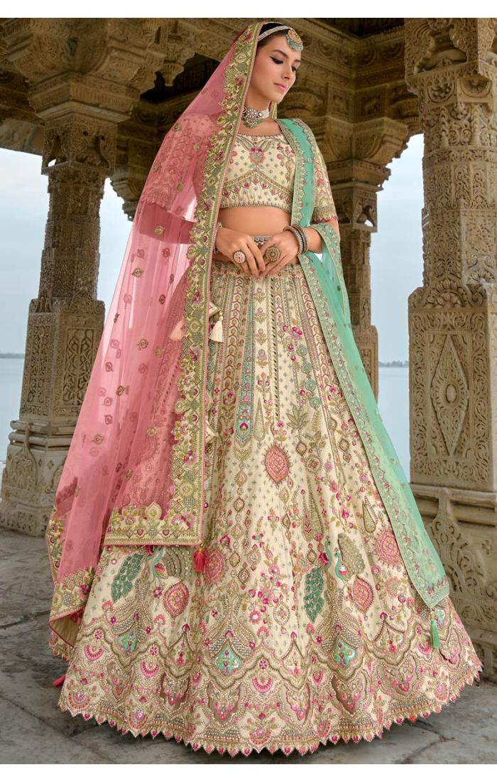 Bridal Lehenga with multi-color Zardosi embroidery and intricate peacock motifs, styled with a green dupatta and a touch of regal elegance.