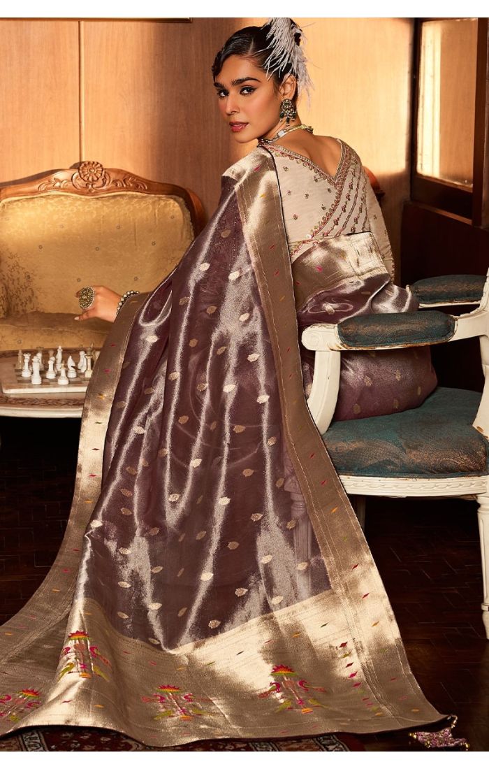 Model styling brown Paithani saree for wedding or festive event