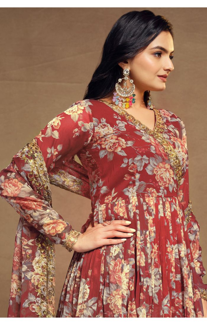 Maroon floral georgette salwar suit with V-neck and golden lace detailing, paired with palazzo pants and dupatta.