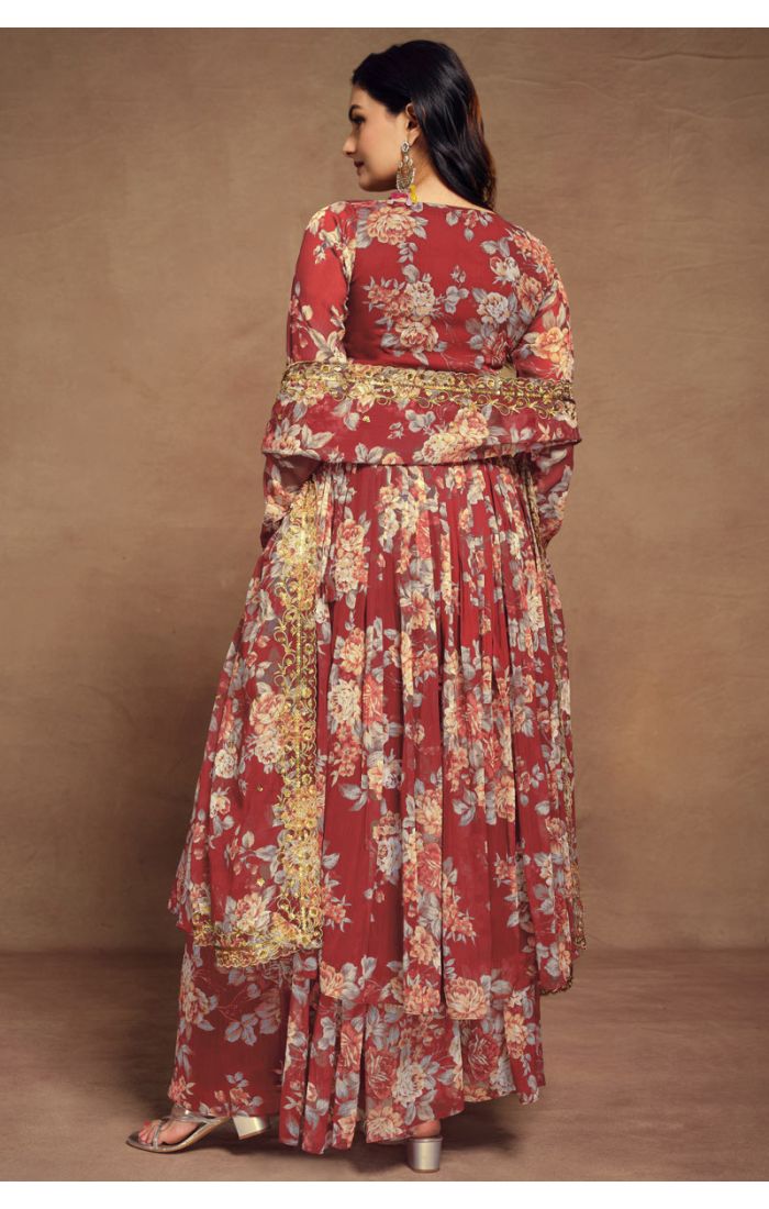 Maroon floral georgette salwar suit with V-neck and golden lace detailing, paired with palazzo pants and dupatta.