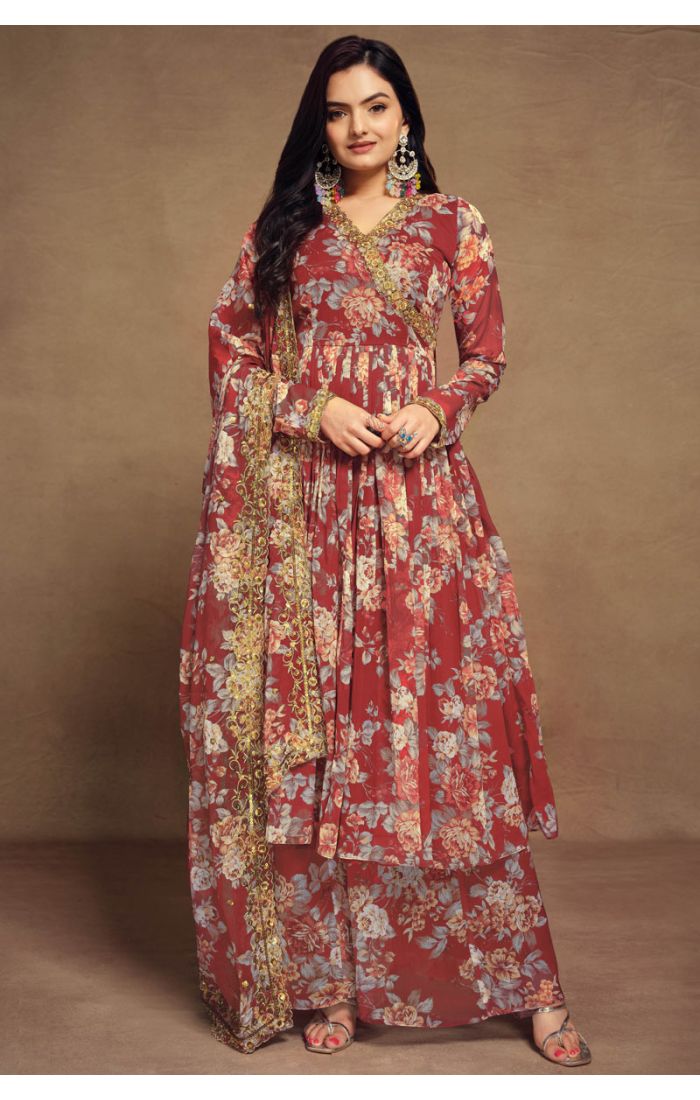 Maroon floral georgette salwar suit with V-neck and golden lace detailing, paired with palazzo pants and dupatta.