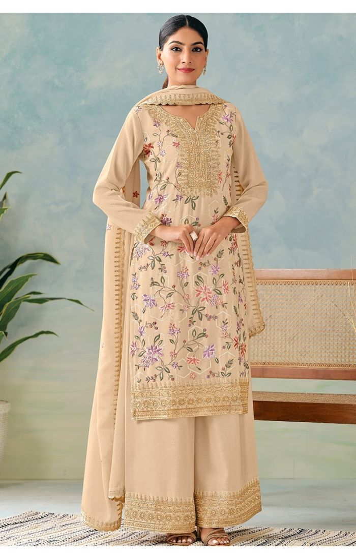  Cream salwar suit front view showcasing heavy embroidery and sequins work with chinon dupatta