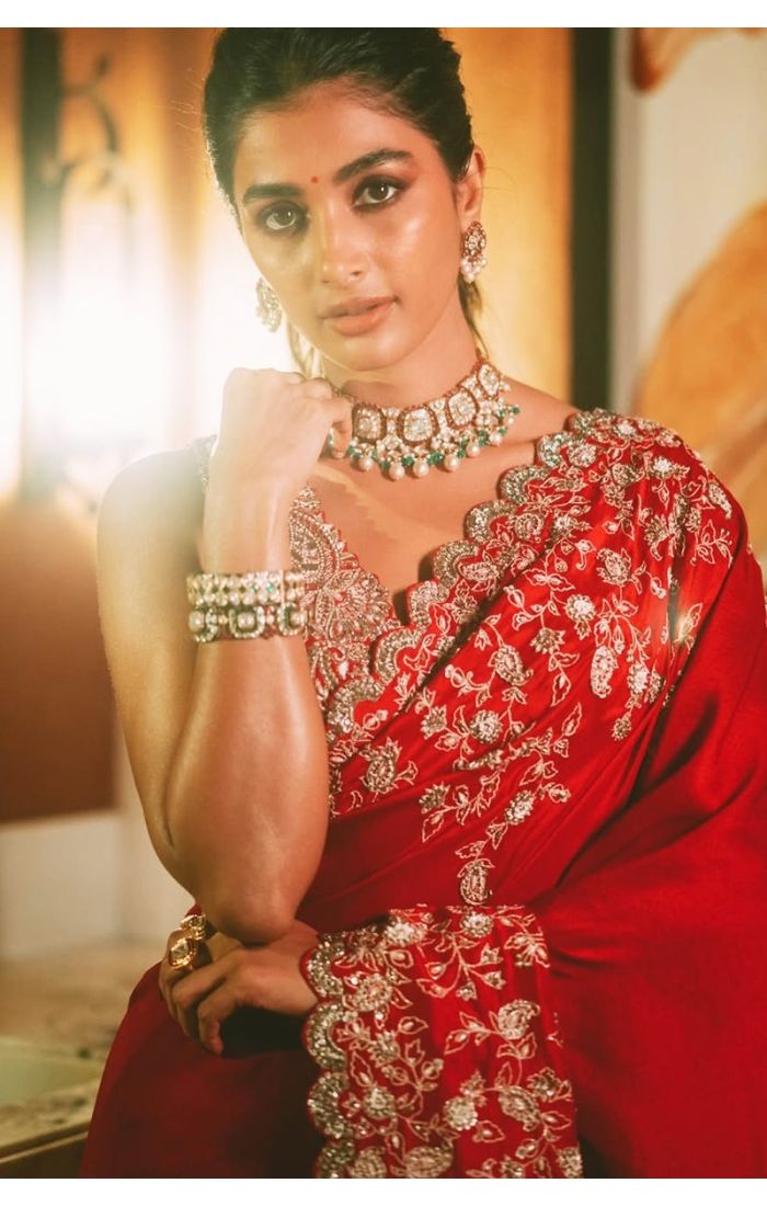 Close-up of embroidered blouse back design in red bridal saree