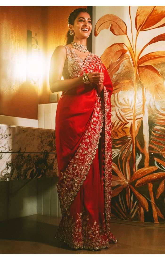  Full-length bridal look in rich red saree with zari embroidery