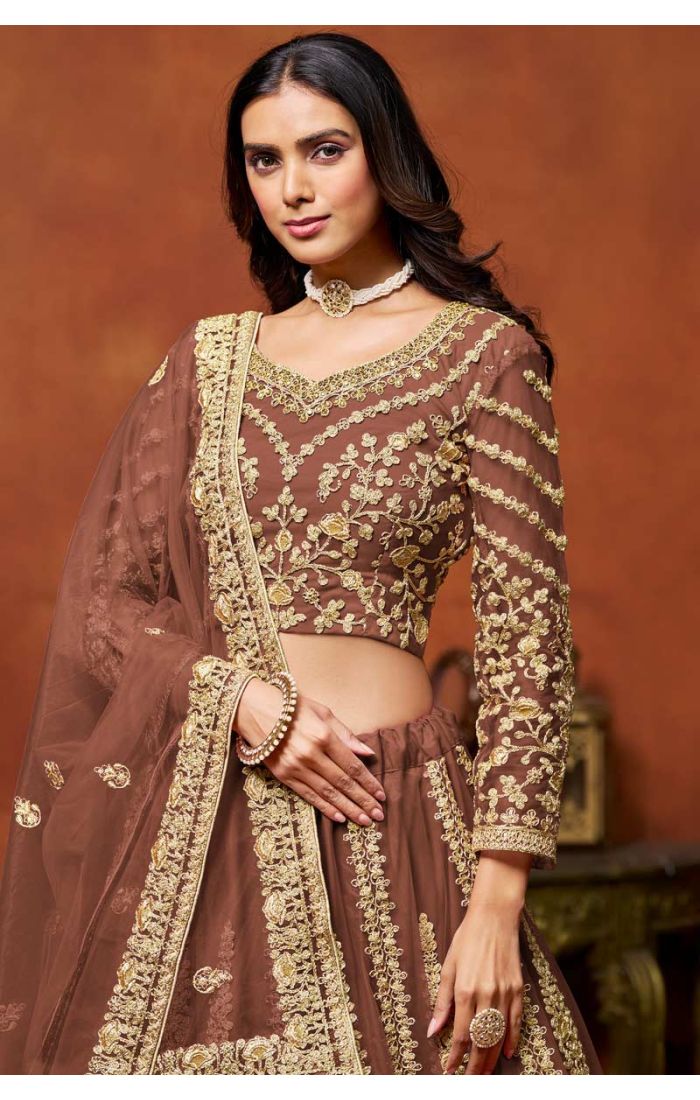 Designer Brown Embroidered Net Lehenga with Golden Choli featuring intricate golden embroidery and luxurious detailing, perfect for weddings and festive celebrations.