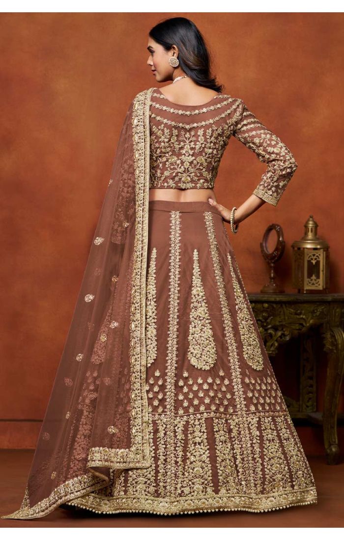 Designer Brown Embroidered Net Lehenga with Golden Choli featuring intricate golden embroidery and luxurious detailing, perfect for weddings and festive celebrations.