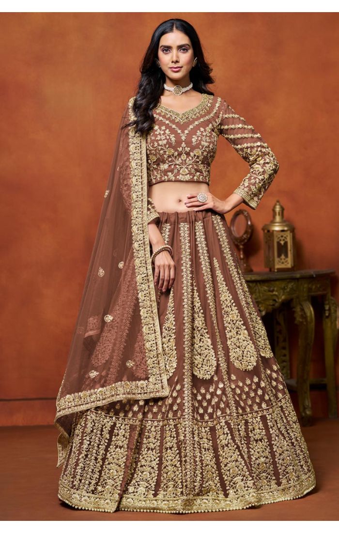 Designer Brown Embroidered Net Lehenga with Golden Choli featuring intricate golden embroidery and luxurious detailing, perfect for weddings and festive celebrations.