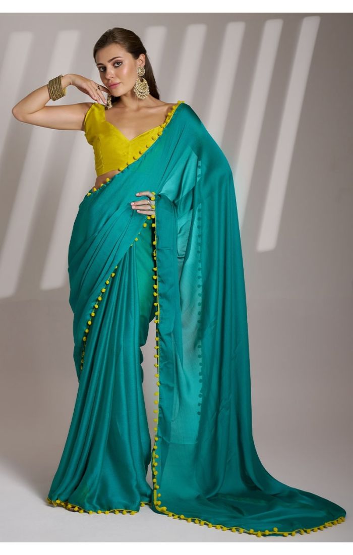 Emerald Green Chiffon Saree with Mustard Yellow Blouse and Pom-Pom Detailing – Perfect for Weddings and Festive Occasions