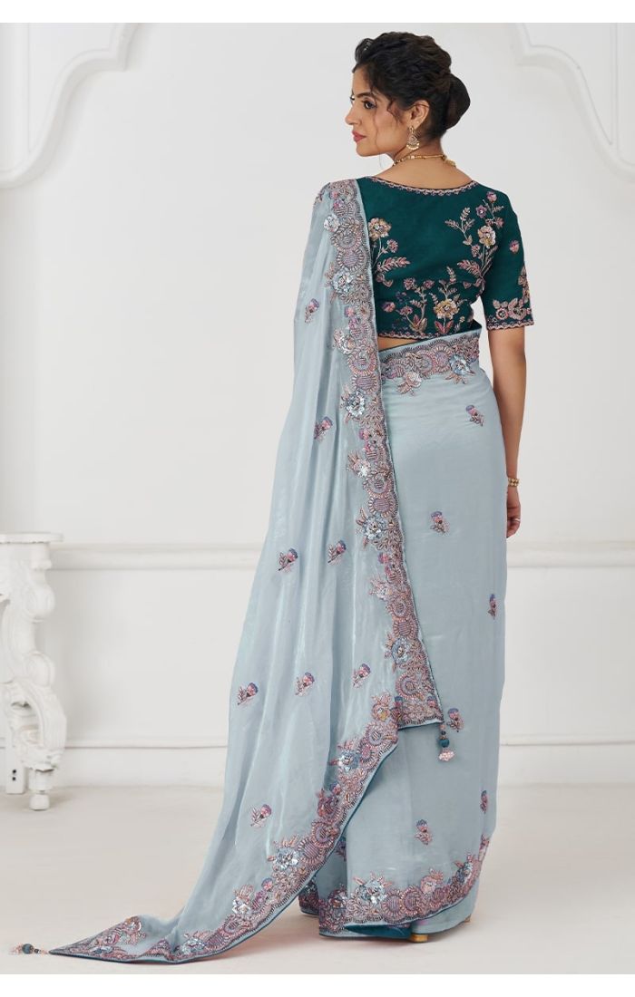  Back view showcasing detailed border embroidery on Fendi silk saree and blouse embroidery.