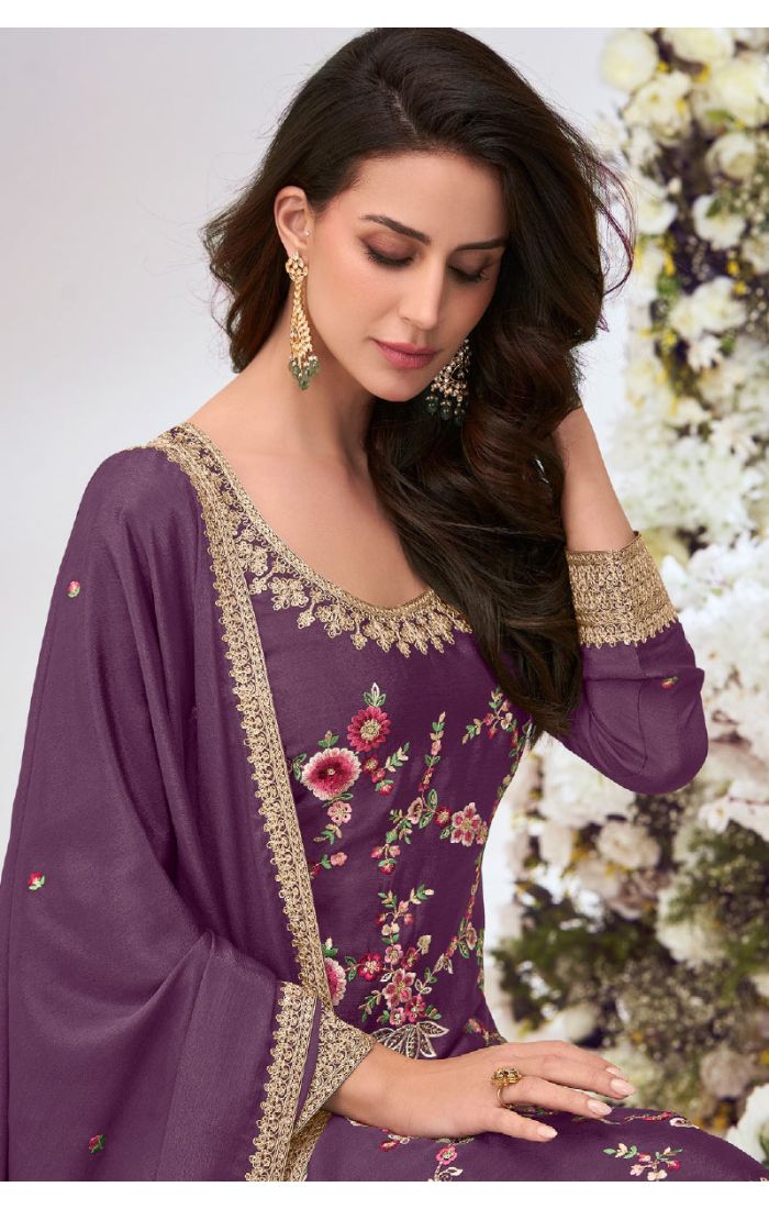 Floral embroidery detailing on scoop neckline and dupatta border.