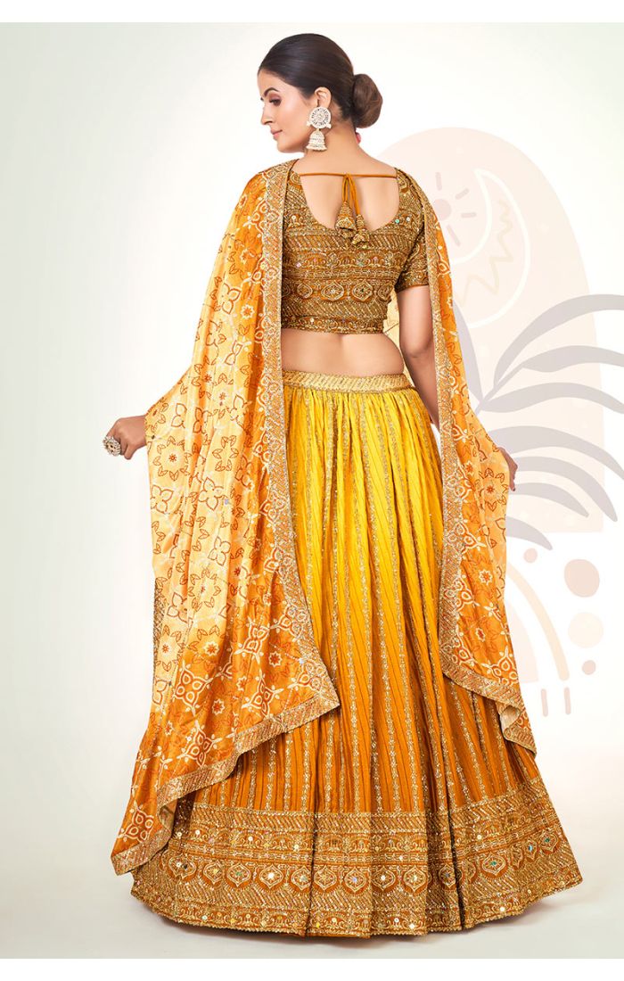 Golden Bandhani Silk Navaratri Lehenga Choli with zari embroidery and Bandhani dupatta