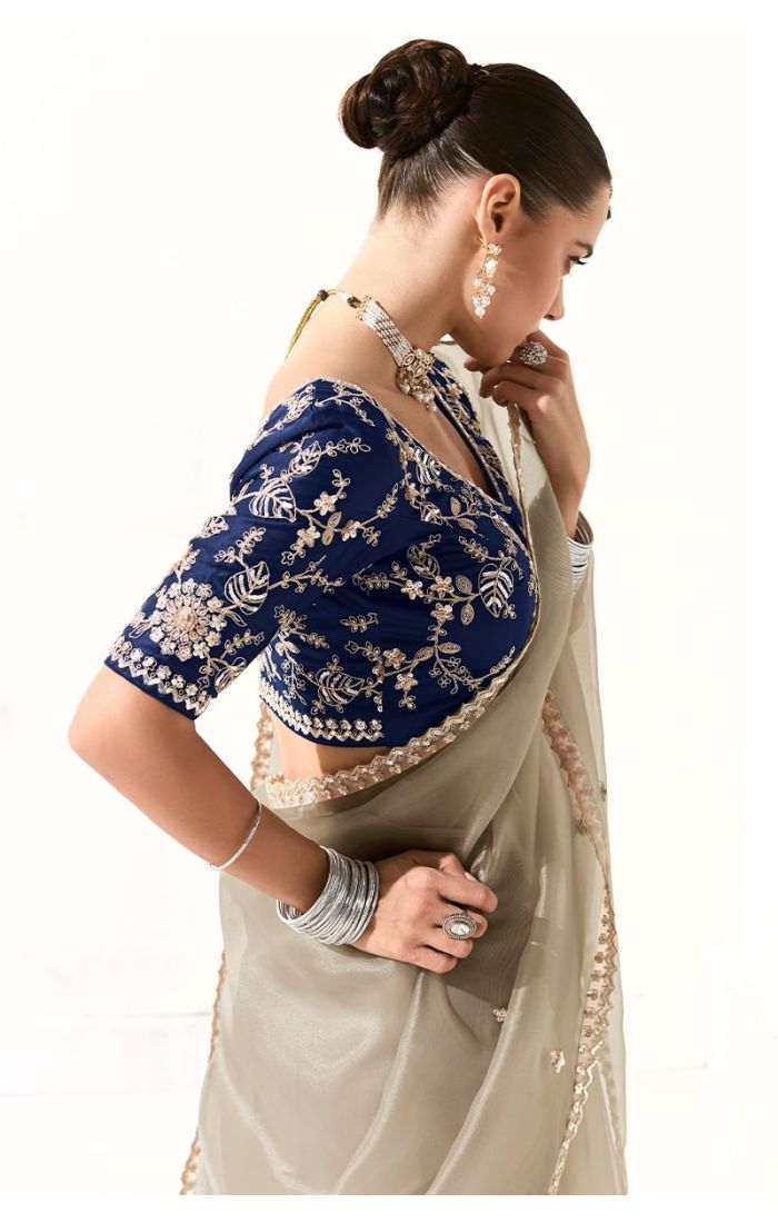 Close-up of navy blue blouse with zari and sequin embroidery