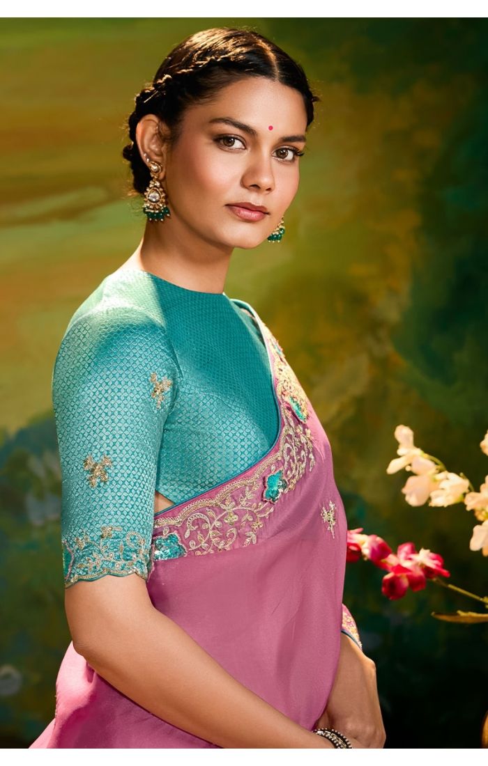  Close-up showcasing resham and sequins embroidery on pink organza saree with lace border