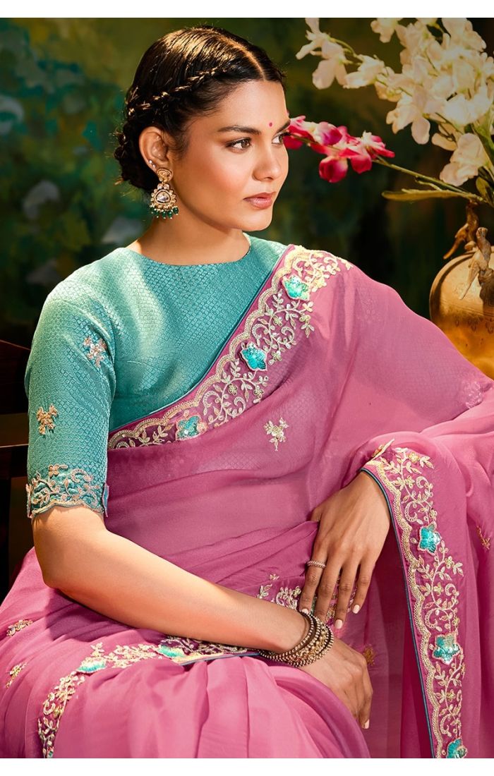 Side drape of pink organza saree with raw silk un-stitched blouse