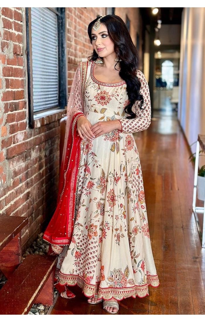 Elegant Ivory Bloom Georgette Plazo Suit with floral embroidery and a scalloped dupatta, ideal for weddings and festive occasions.