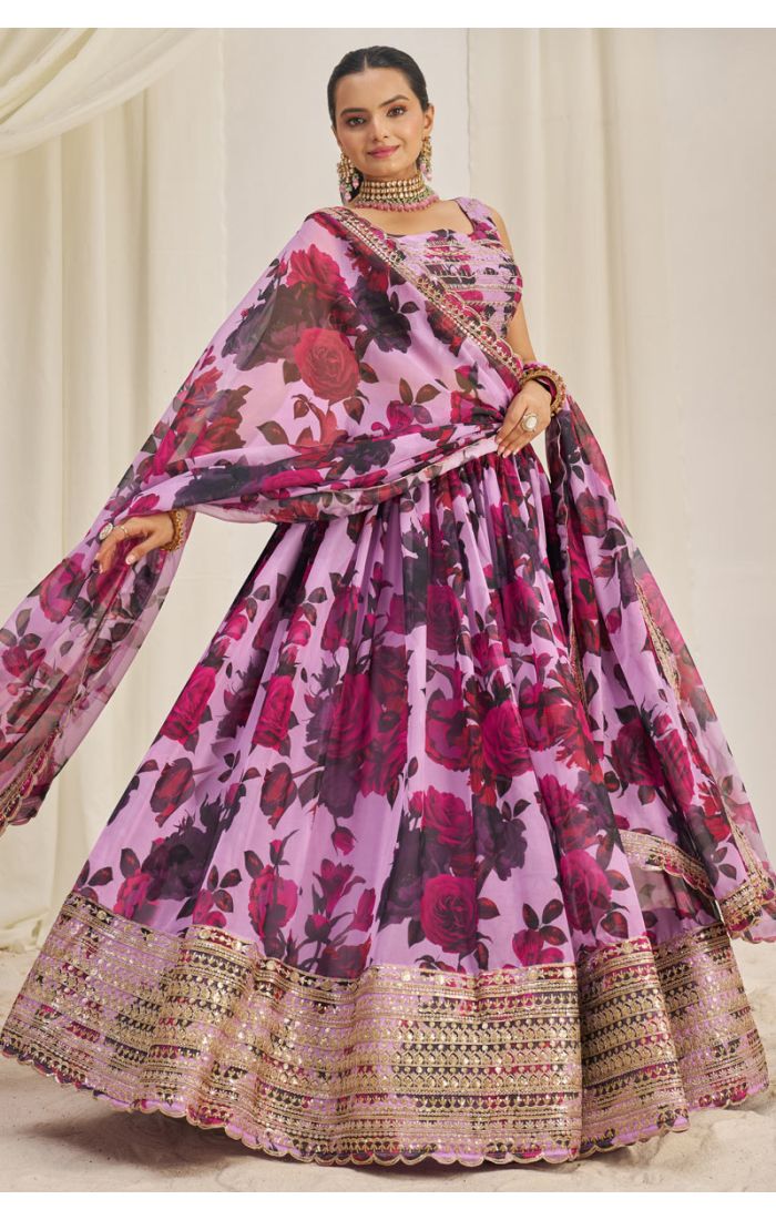 Model twirling in lavender floral georgette lehenga choli with lace border dupatta — LEHV4123