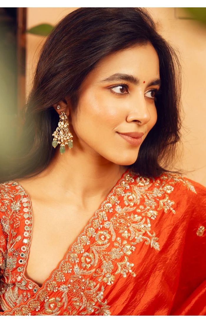 Close-up of orange satin silk saree blouse with zari embroidery – SREA2292