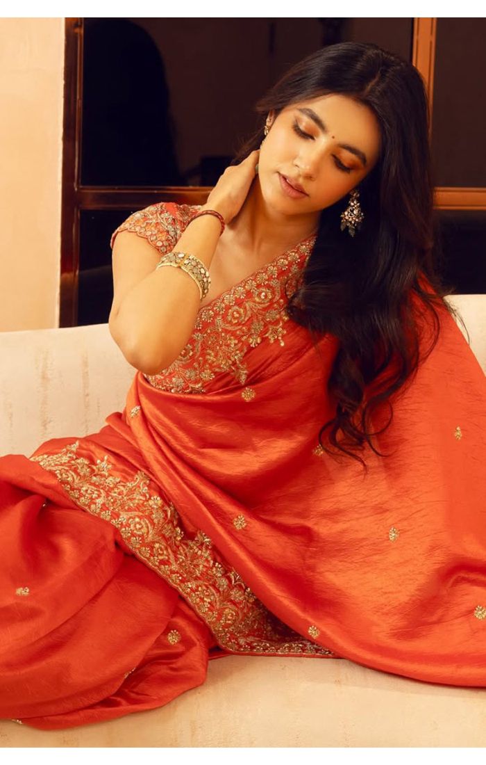 Close-up of orange satin silk saree blouse with zari embroidery – SREA2292