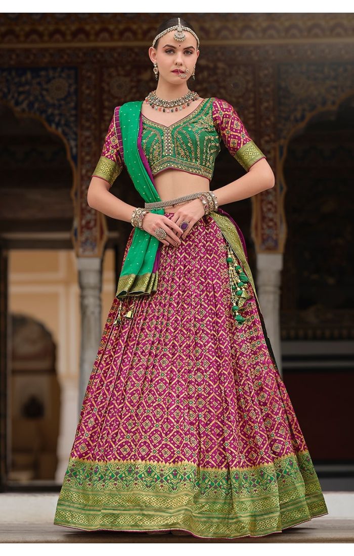 Magenta zari embroidered silk lehenga choli with green dupatta – perfect for weddings, festivals, and Indian ethnic wear lovers in the UK, USA, Canada, and Europe.