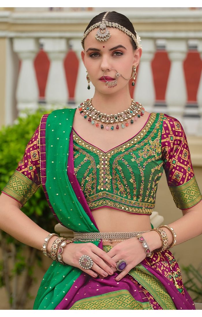 Magenta zari embroidered silk lehenga choli with green dupatta – perfect for weddings, festivals, and Indian ethnic wear lovers in the UK, USA, Canada, and Europe.