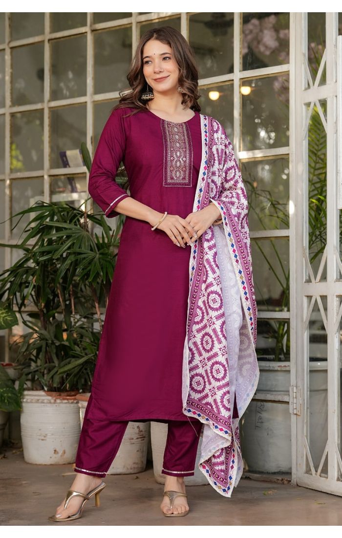 Maroon embroidered cotton kurta pant set with printed dupatta for festive and wedding occasions.