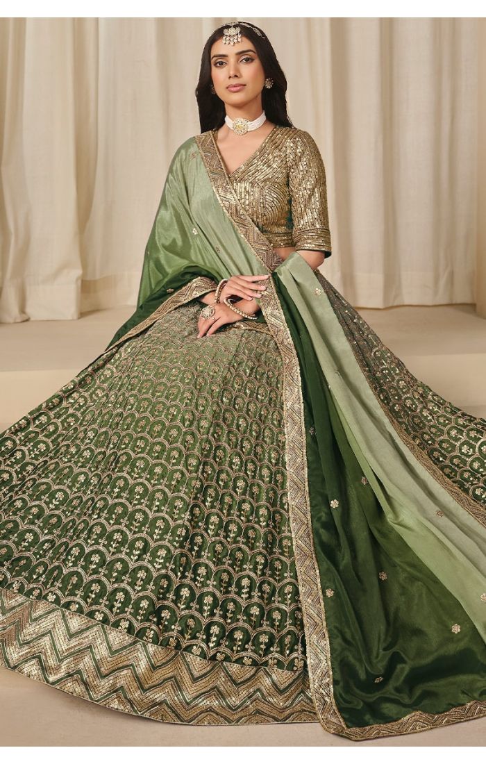 Sitting pose showcasing lehenga flare and sequin detailing