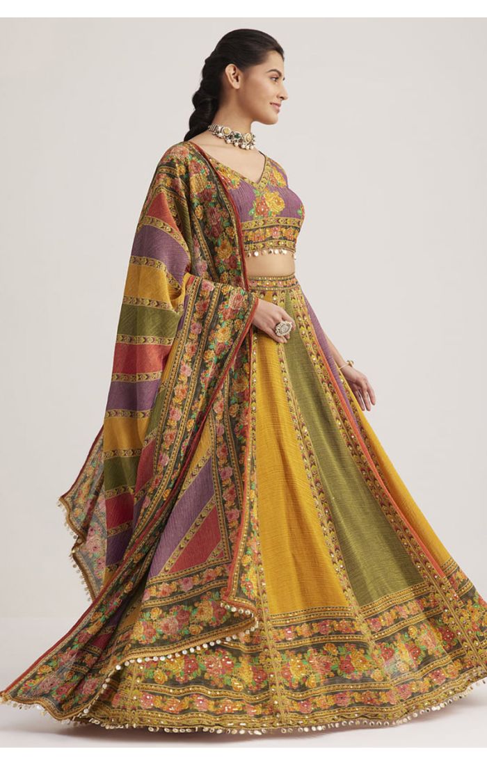 Model wearing multi-color silk Navaratri lehenga choli with floral print and V neck blouse, designer party wear chaniya choli
