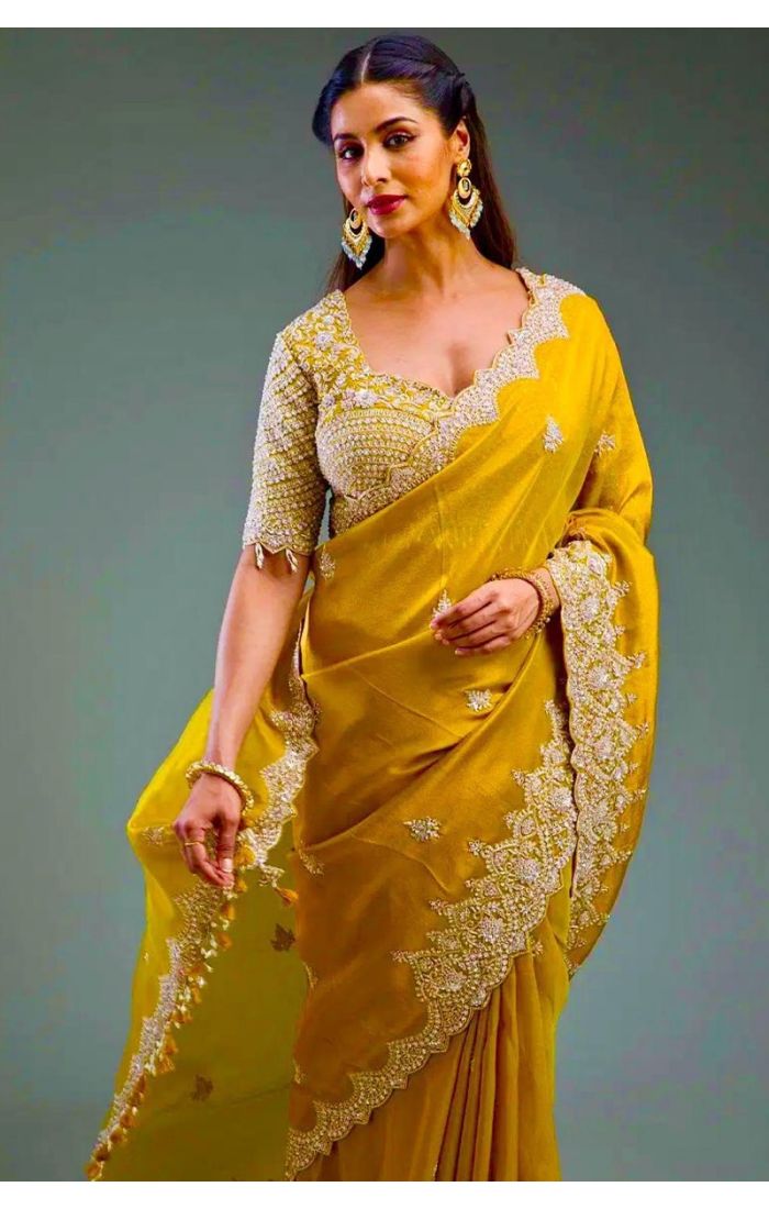  Side angle of mustard saree with heavy embroidery and stylish blouse