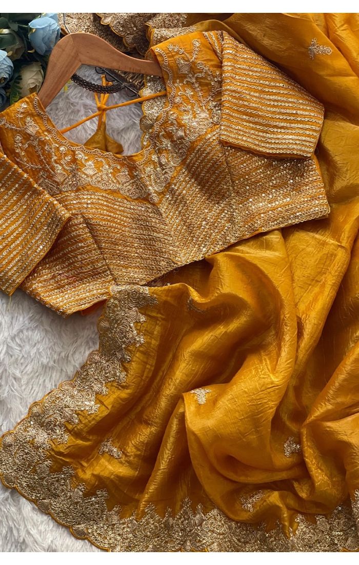blouse clouse-up of embroidered blouse and saree pallu lace – mustard color