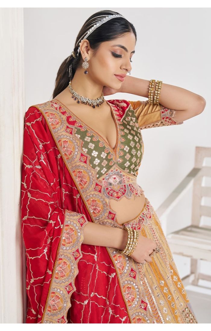 Close-up of mustard lehenga blouse with zari and aari embroidery – luxury ethnic wear