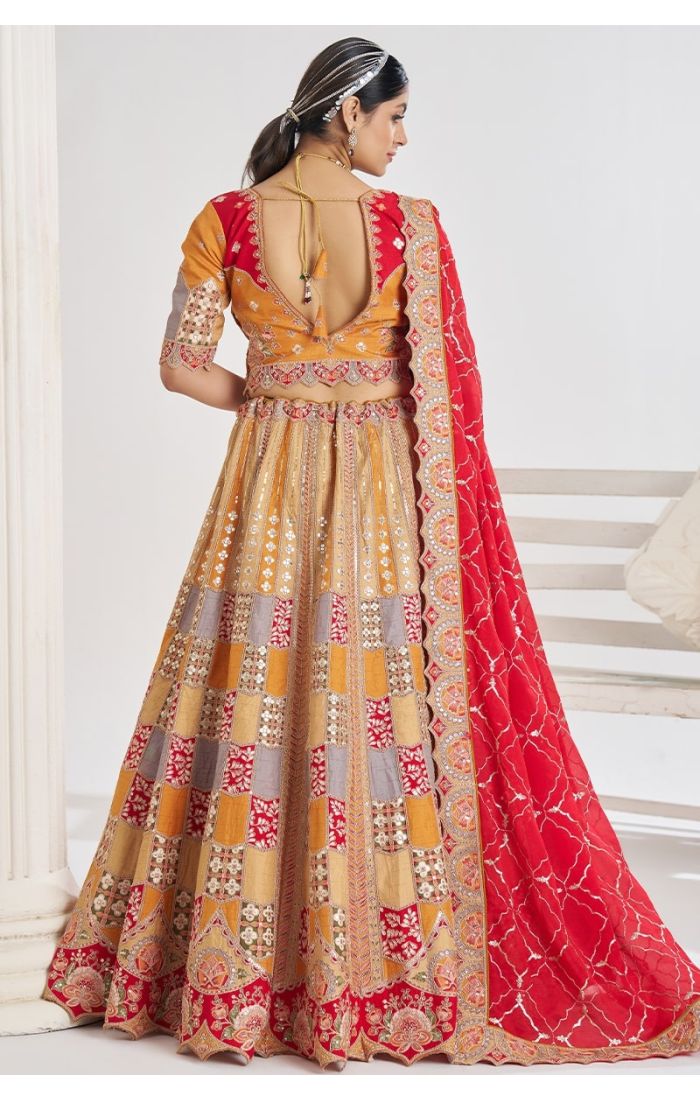 Back view of mustard net lehenga with jaal print and red dupatta – ethnic partywear