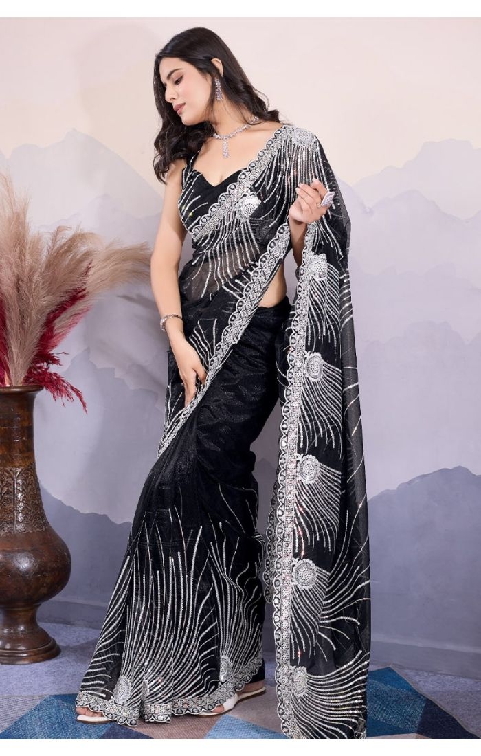 Side drape styling of black sequin embroidered C-Pallu saree for evening parties