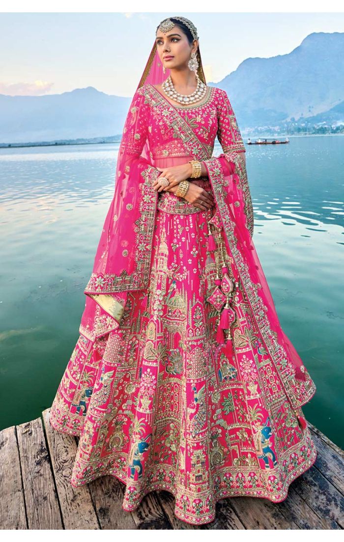 Pink bridal lehenga with zardosi and thread embroidery, ideal for weddings, showcasing intricate design and traditional elegance.