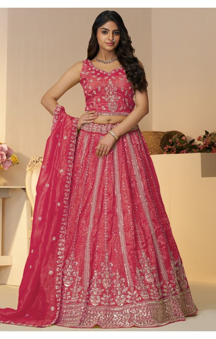 Front view of traditional pink lehenga choli with embroidered blouse and paisley motifs