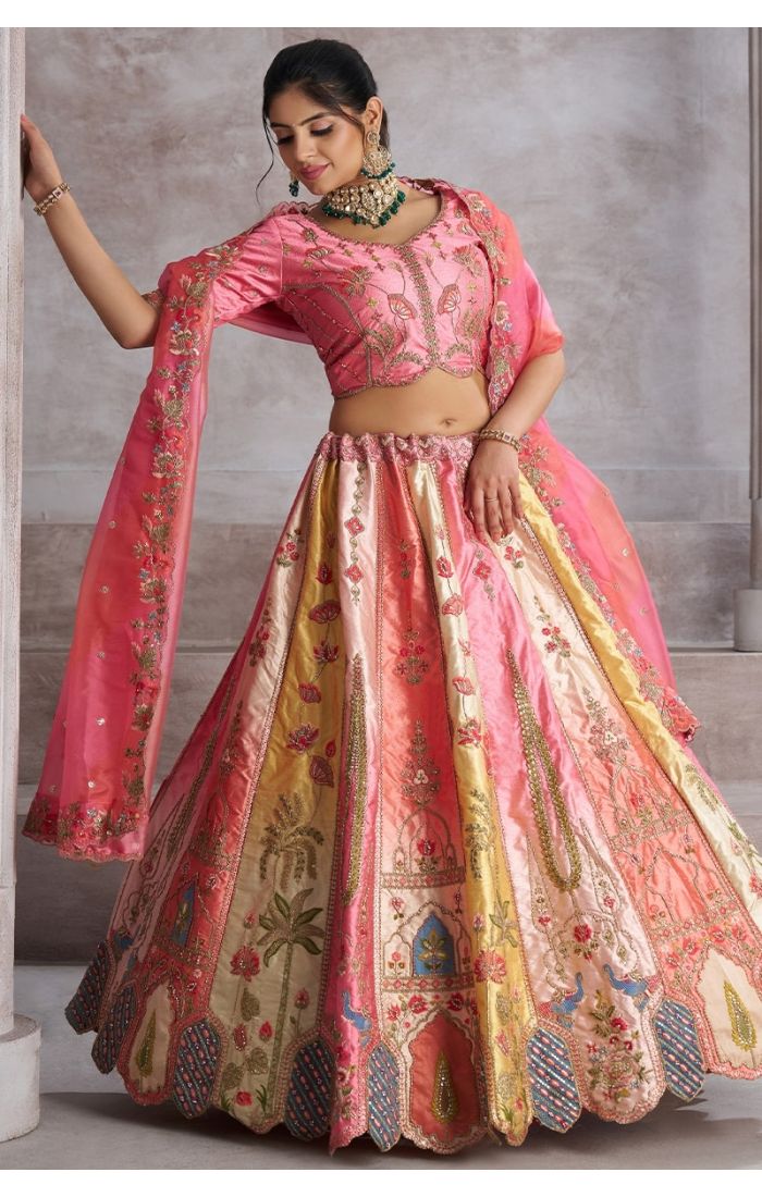 Side profile of traditional pink lehenga with intricate embroidery for brides – Shop Ethnic Wear Online