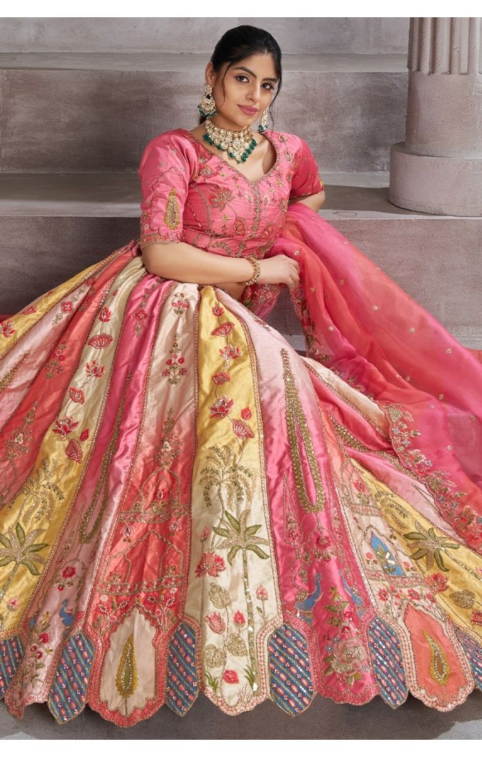 Sitting view of embroidered bridal lehenga in pink with paisley design – Appelle Fashion Canada