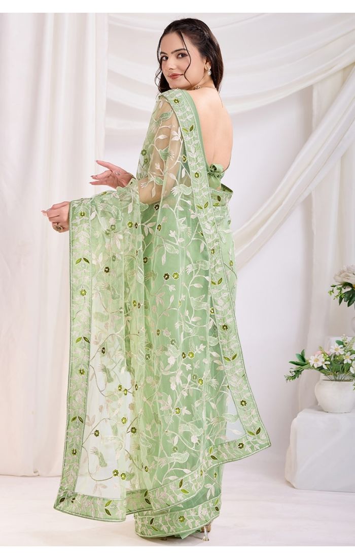 Back view of pista designer thread embroidery saree, perfect for festive and wedding occasions.
