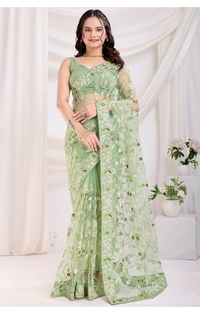 Elegant pista soft net saree with designer thread embroidery for weddings and parties.