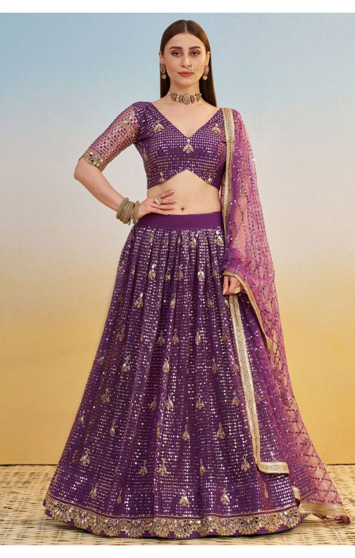 Flared skirt and intricate border design of purple sequin embroidered lehenga with zari accents, premium party and wedding wear.