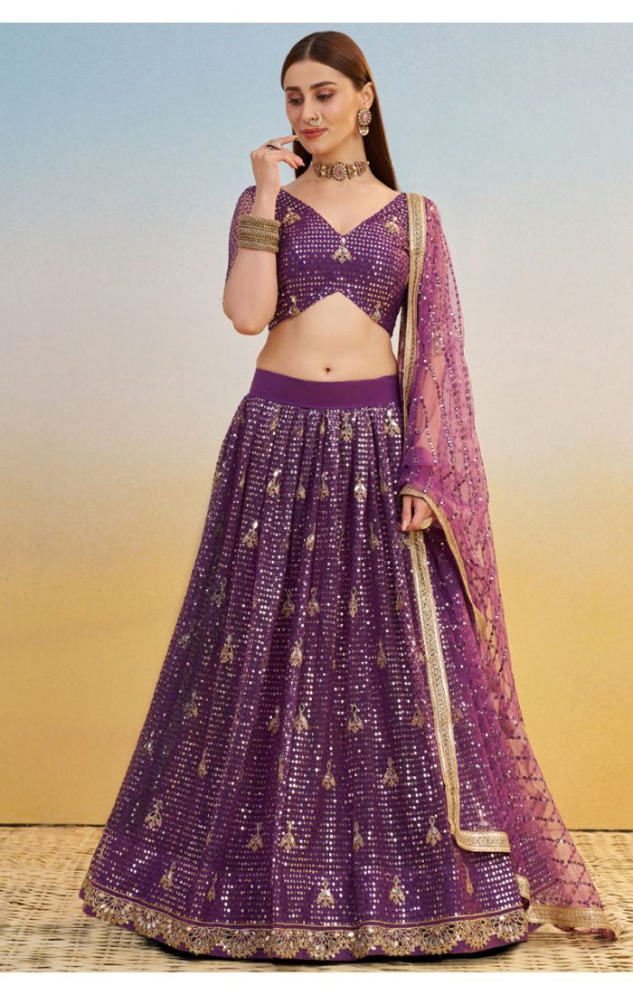 Purple sequin embroidered net lehenga with zari motifs, V-neck blouse — full front view, luxury wedding or party wear, Appelle Fashion.