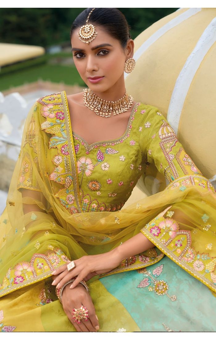 A luxurious lime green and gold Banarasi bridal lehenga with hand embroidery, perfect for Indian weddings and festive occasions.