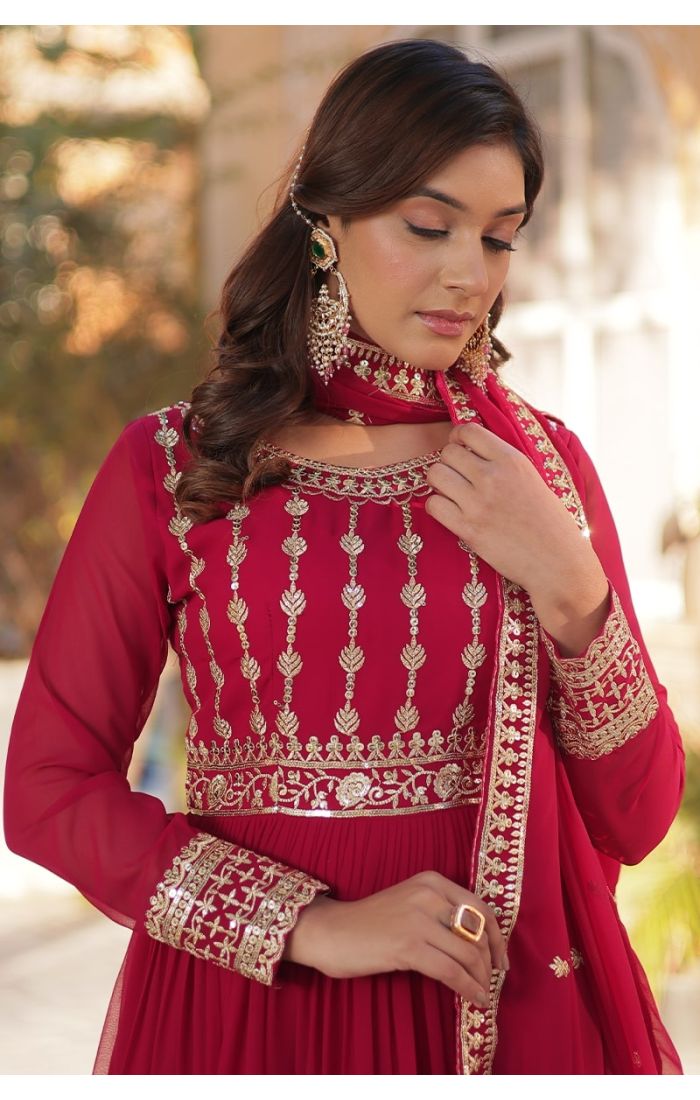  Ruby red Georgette Anarkali suit with golden embroidery, ideal for weddings and festive occasions.