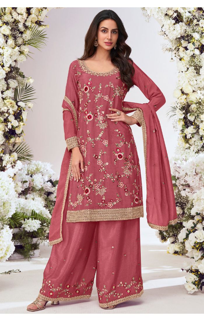 Rose pink soft silk suit set with floral embroidery, round neck design, matching palazzo pants, and embroidered dupatta – ideal for weddings and festive occasions.