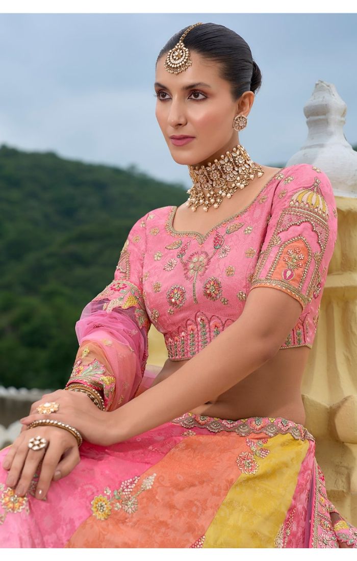 Royal Sunset Banarasi Lehenga – Traditional Indian Wedding Wear in Peach, Pink & Gold with Handcrafted Embroidery