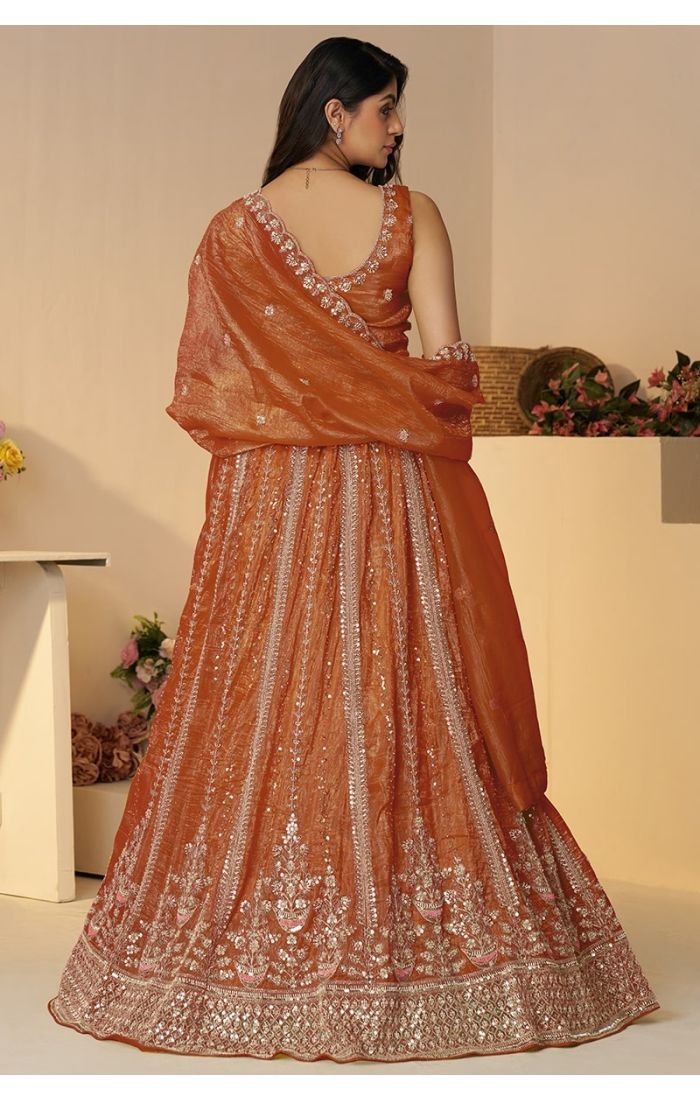 Back embroidery and dupatta details of rustic orange lehenga – Appelle Fashion