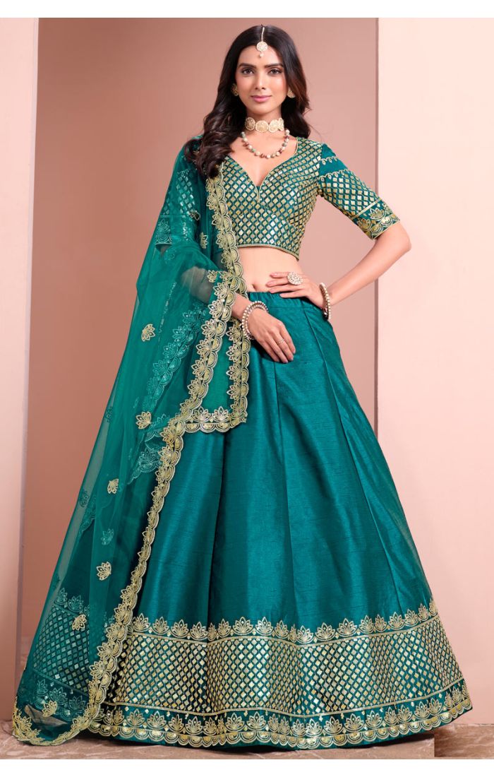 Teal green premium silk satin lehenga choli with zari and sequin embroidery, styled with organza dupatta — Appelle Fashion