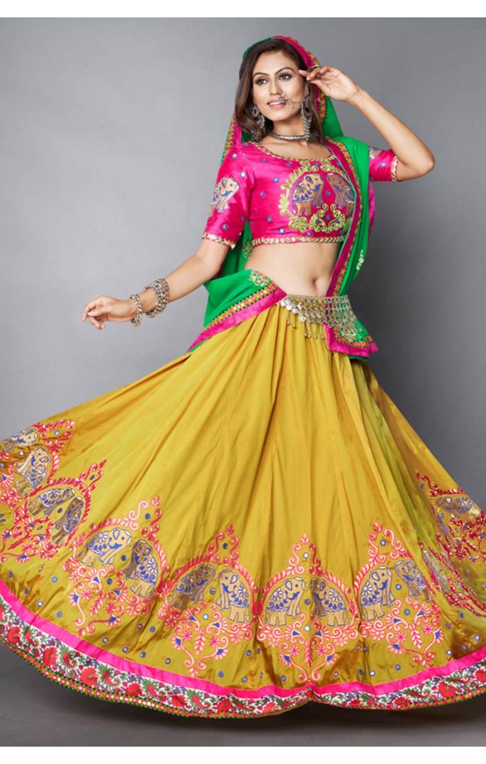 Detailed view of pink embroidered blouse and contrasting green dupatta with mirror accents, Navratri festival outfit.