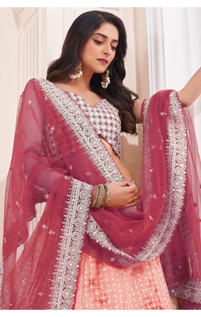 Designer Lehenga Choli with embroidery and dupatta for festive occasions.